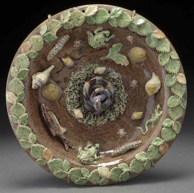 Appraisal: French palissy plate centered by a coiled snakeon a mossy