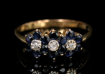 Appraisal: A Dainty Sapphire and Diamond Ring k yellow gold band