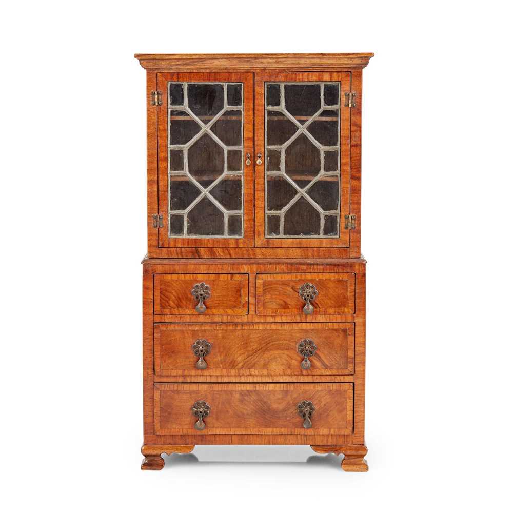 Appraisal: MINIATURE GEORGE II STYLE WALNUT BOOKCASE-ON-CHEST TH CENTURY the moulded