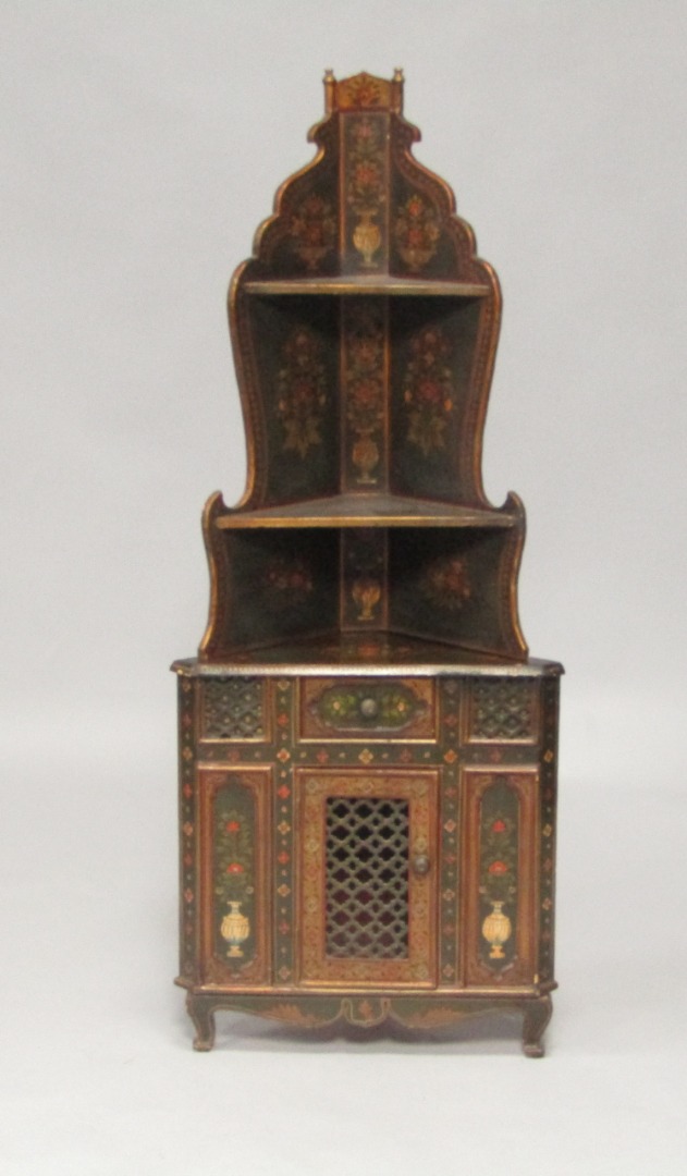 Appraisal: A Continental painted corner cupboard with two tiered shelves above