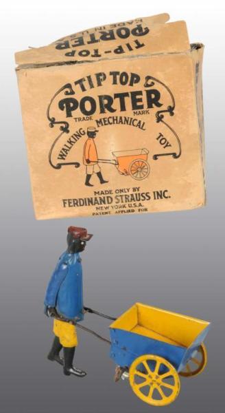 Appraisal: Tin Strauss Tip Top Porter Wind-Up Toy Description Working Some