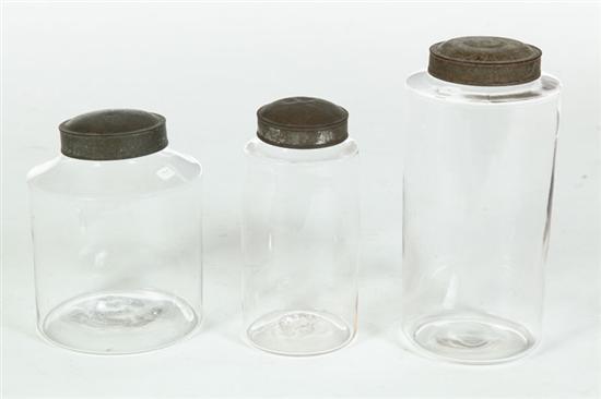 Appraisal: THREE BLOWN GLASS CANISTERS American th century With tin lids