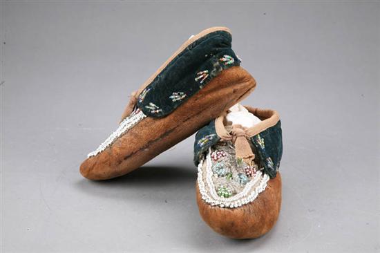 Appraisal: MOCCASINS Made of hide with beaded decoration l