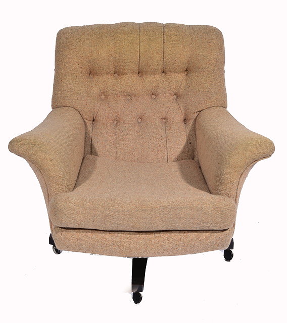 Appraisal: A 'G' PLAN BUTTON BACK UPHOLSTERED ROTATING ARMCHAIR cm wide