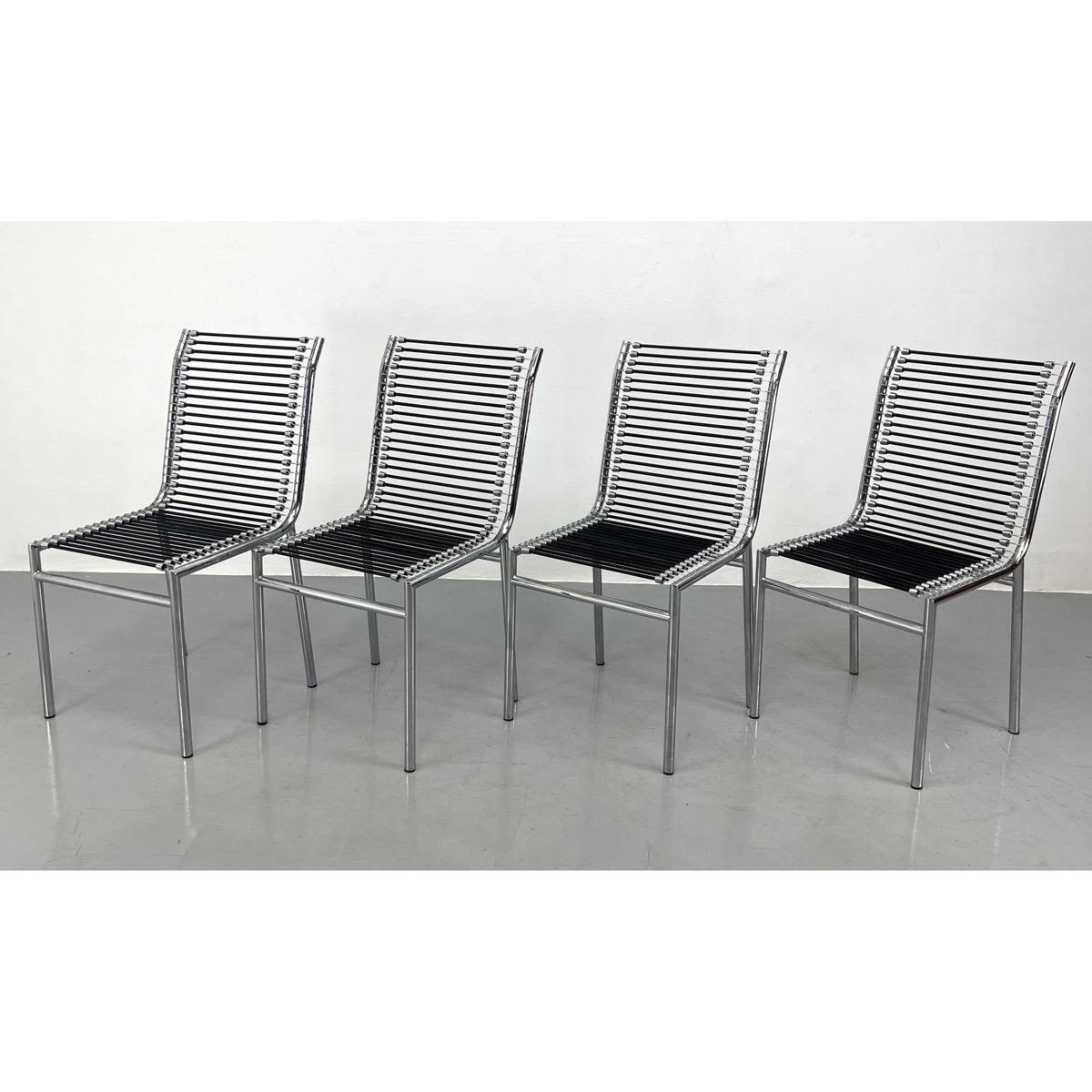 Appraisal: Set Rene Herbst Style Dining Chairs Chrome spring cord design