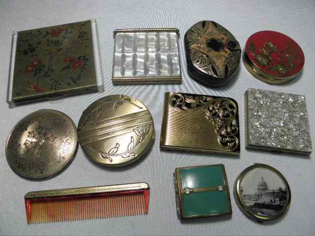 Appraisal: Assorted vintage powder compacts and a comb Includes compact brands