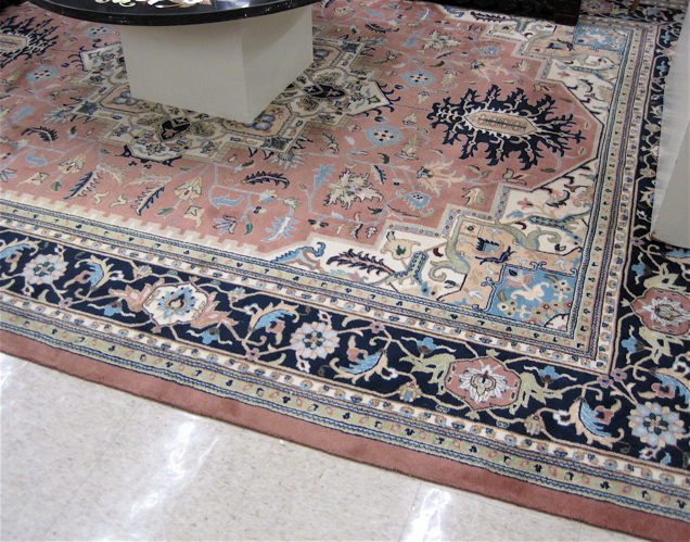 Appraisal: HAND KNOTTED ORIENTAL CARPET Indo-Heriz central geometric medallion and stylized