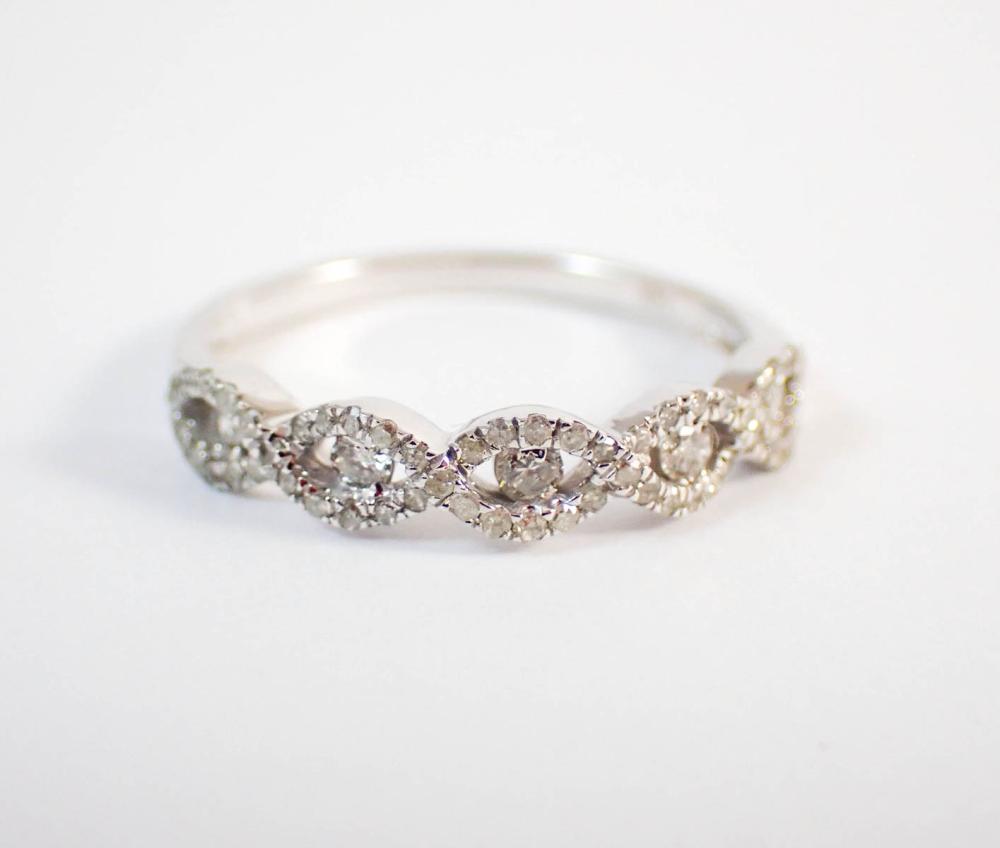 Appraisal: DIAMOND AND FOURTEEN KARAT WHITE GOLD RING The top section