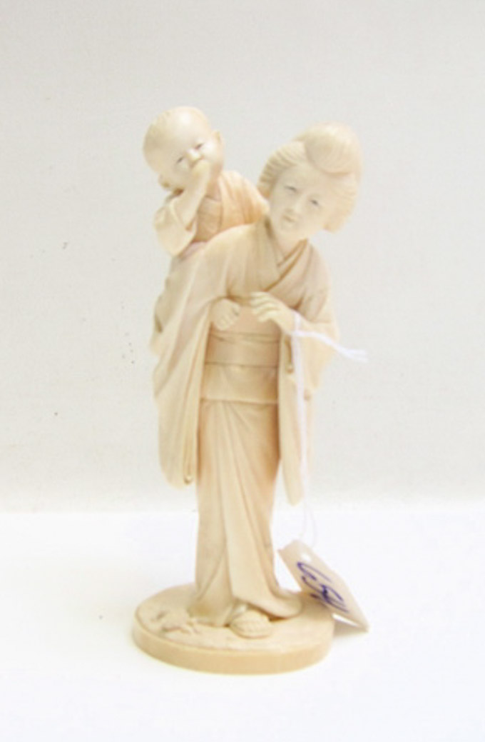 Appraisal: JAPANESE CARVED IVORY FIGURAL of a mother with infant child