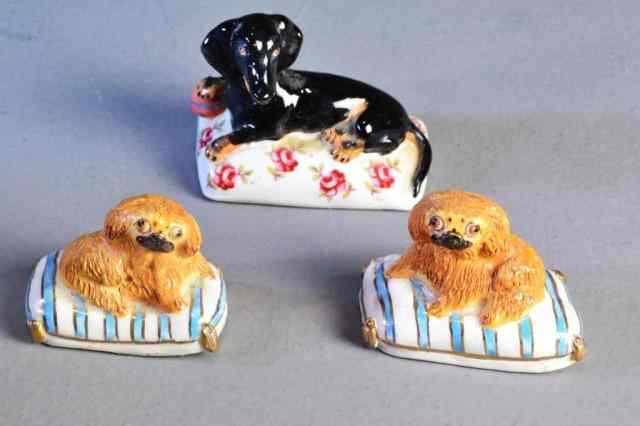 Appraisal: PC BASIL MATTHEWS PORCELAIN DOG FIGURINESIncluding matching set of two