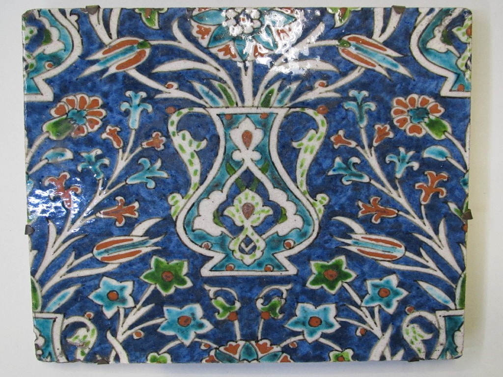 Appraisal: Persian tile decorated with vase of flowers