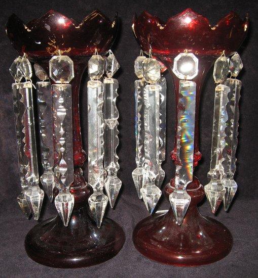 Appraisal: A pair of ruby glass lustres with wavy rims and