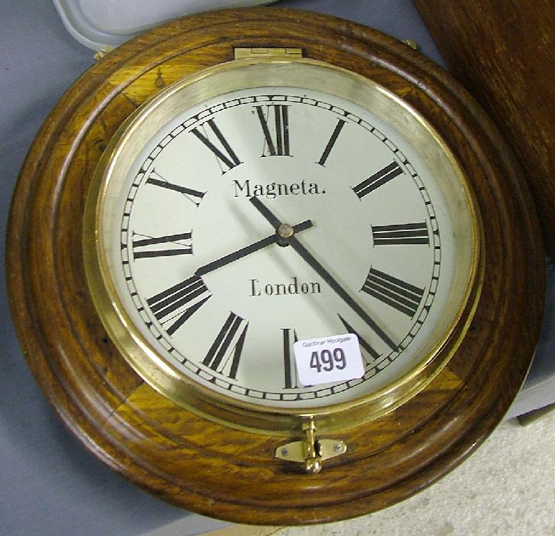 Appraisal: Oak slave dial signed Magneta London within an oak turned