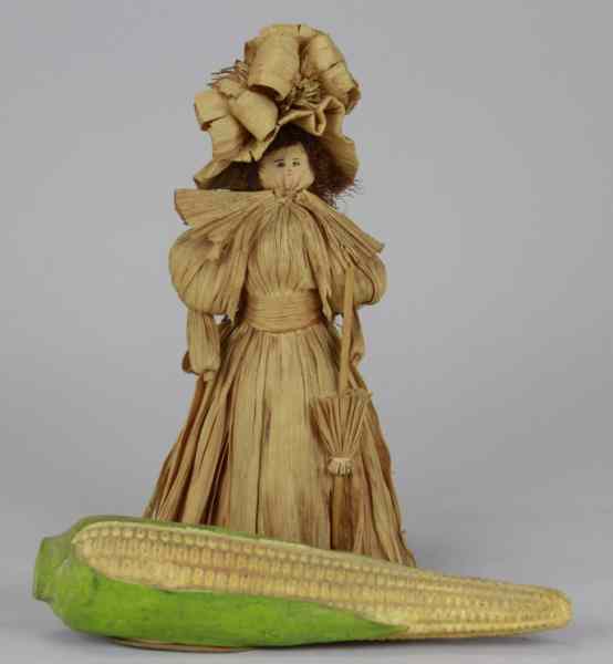 Appraisal: EAR OF CORN CANDY CONTAINER CORN HUSK DOLL Germany hand