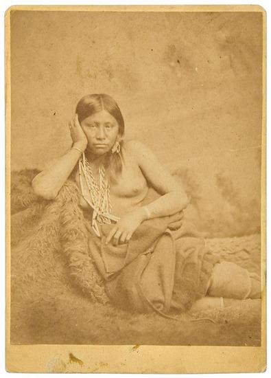 Appraisal: INDIANS Double-sided cabinet card photograph with a studio full-length portrait