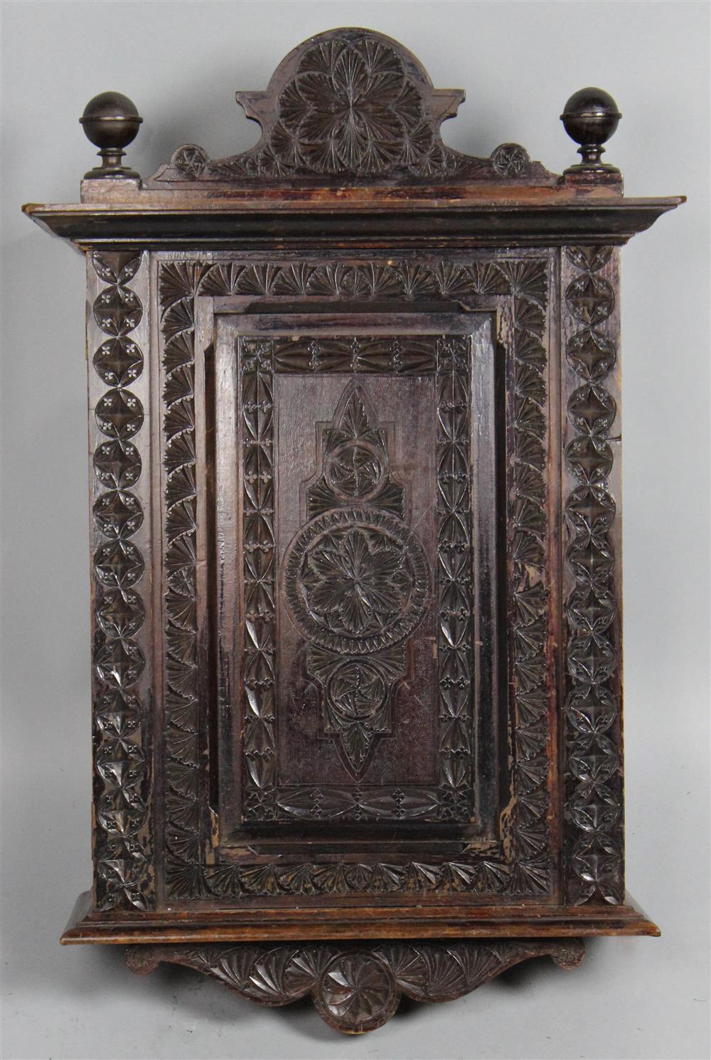 Appraisal: PROVINCIAL CARVED AND STAINED PINE AND FRUITWOOD HANGING CABINET late