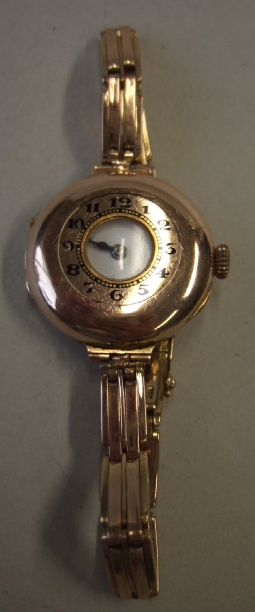 Appraisal: A ladies ct gold circular cased half hunting cased wristwatch