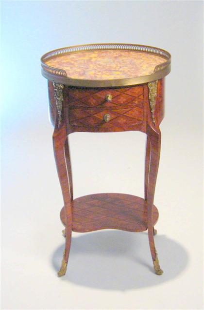 Appraisal: Transitional style tulipwood parquetry table en chiffonier The oval violet