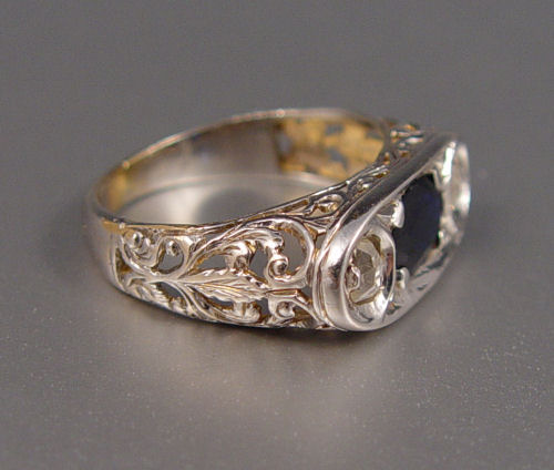 Appraisal: K FILIGREE RING WITH A CT SAPPHIRE AND ROSE AND