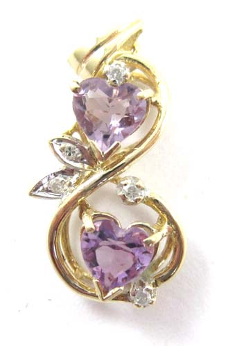 Appraisal: AMETHYST DIAMOND AND FOURTEEN KARAT GOLD PENDANT set with two