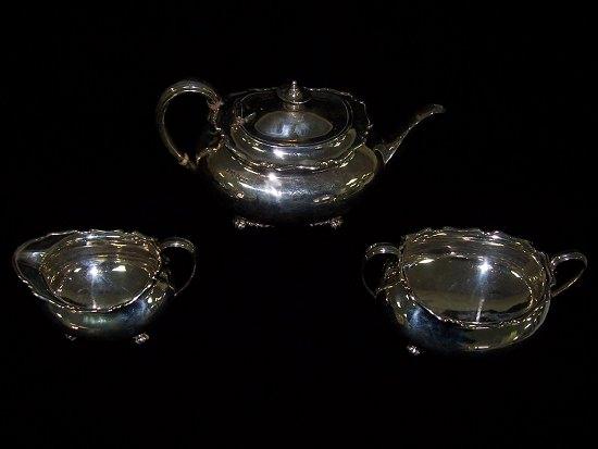 Appraisal: A three-piece tea set comprising teapot cream jug and sugar