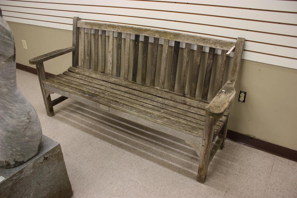 Appraisal: WEATHERED TEAK PARK BENCH featuring an affixed metal placard that