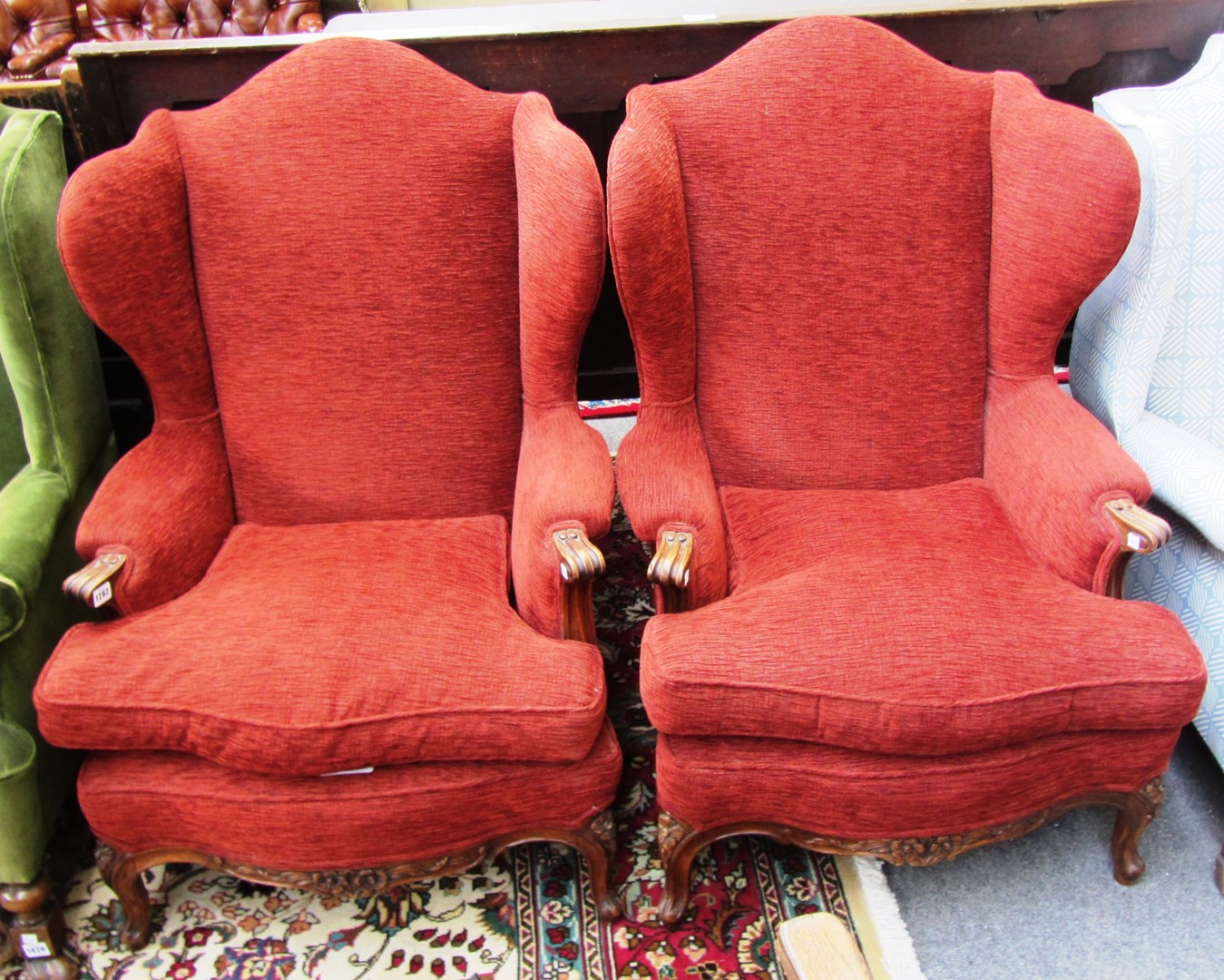 Appraisal: A pair of Louis XV style wingback armchairs on floral