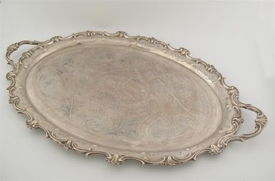 Appraisal: A large Edwardian two-handled tray of shaped oval outline with