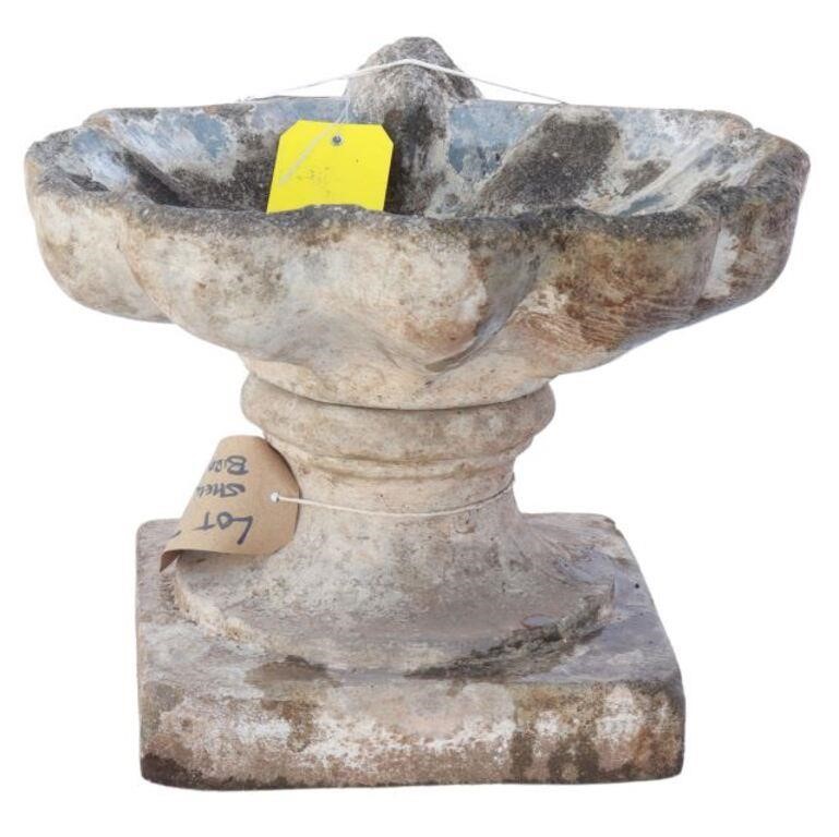 Appraisal: Cast stone shell-form bird bath th c rising on square