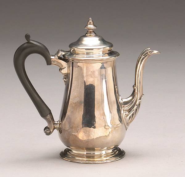 Appraisal: A silver coffee pot with wooden handleBearing hallmarks for Thomas