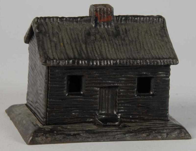 Appraisal: Cast Iron Log Cabin Still Bank Description Circa Manufactured by