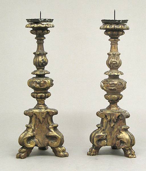 Appraisal: A small assembled pair of Baroque style giltwood prickets th