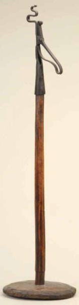 Appraisal: European Iron Rush Light on Wooden Stand Description th Century