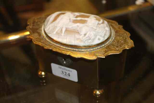 Appraisal: A BRASS TRINKET BOX with velvet lined interior shaped lid