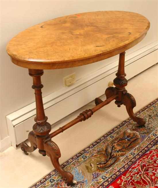 Appraisal: A Victorian burr walnut side table Circa The oval top