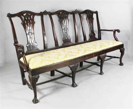 Appraisal: A George II design carved walnut triple chair back settee