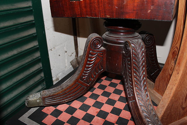 Appraisal: A REGENCY STYLE MAHOGANY LOW OCCASIONAL TABLE with circular top