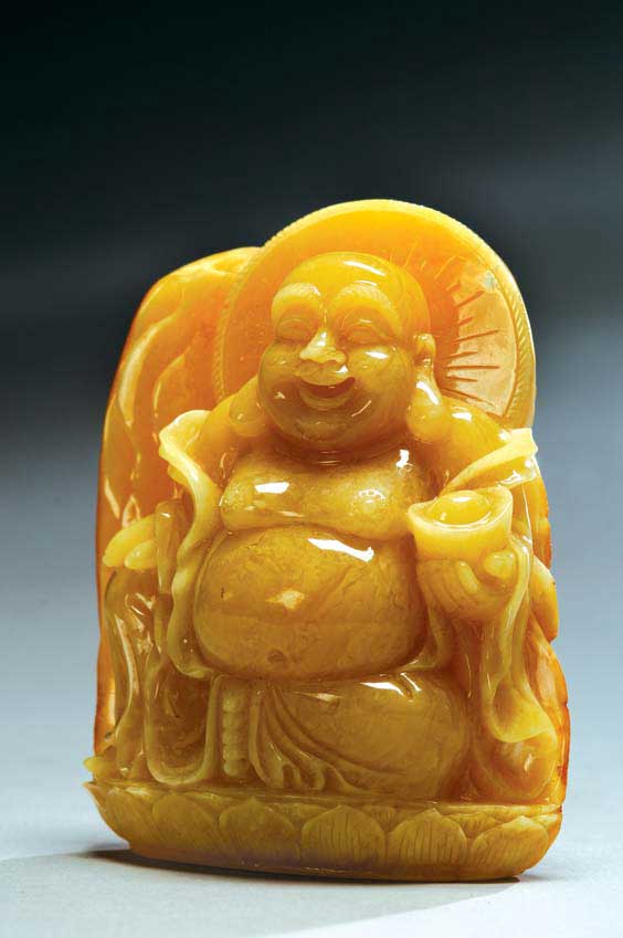 Appraisal: CARVED AMBER BUDAI A well carved Chinese amber figure of