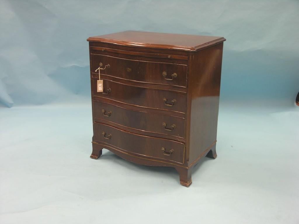 Appraisal: A mahogany bachelor's chest serpentine-fronted with brushing slide and four