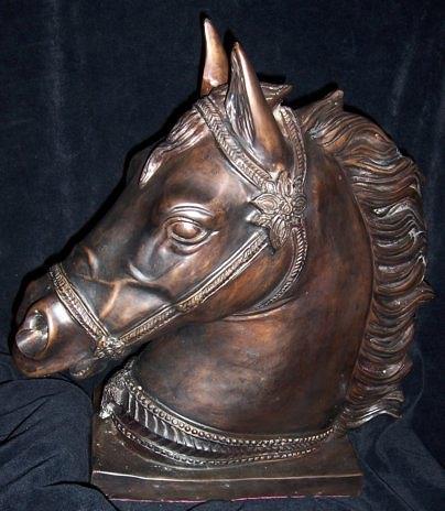 Appraisal: A cast metal model of a horse's head on a