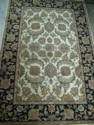 Appraisal: HAND KNOTTED ORIENTAL AREA RUG Indo-Persian overall floral decoration on