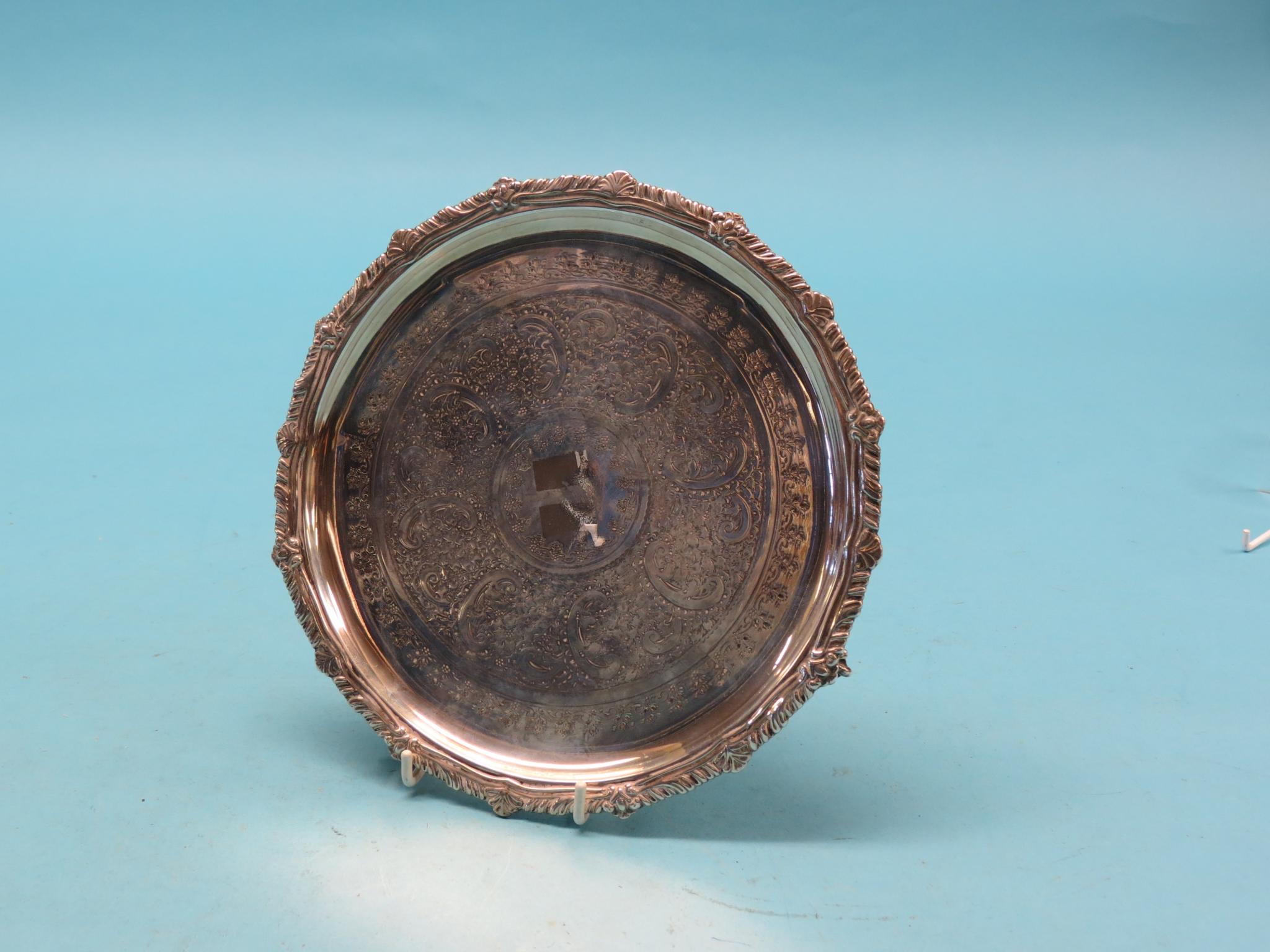 Appraisal: A silver card tray circular-shape with cast border and engraved