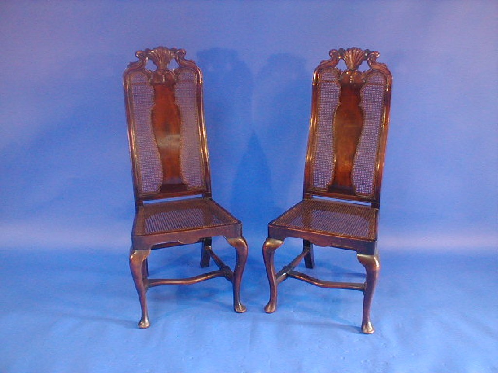 Appraisal: A pair of thC walnut high back hall chairs with