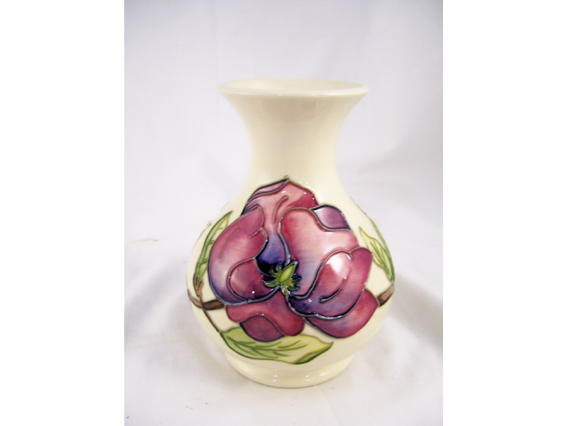 Appraisal: Moorcroft Magnolia Vase Low vase with a white field and