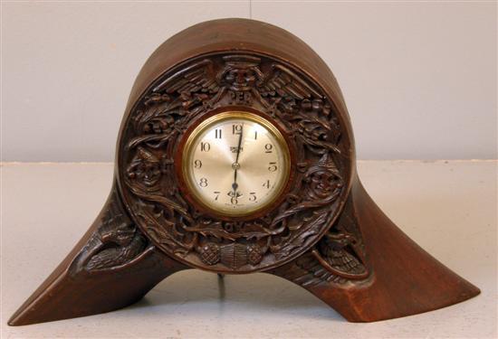 Appraisal: Electric mantel clock the carved case from the centre section