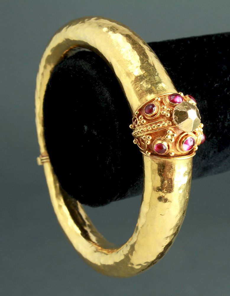 Appraisal: K Yellow Gold Rubies Hinged Bangle Bracelet High karat yellow