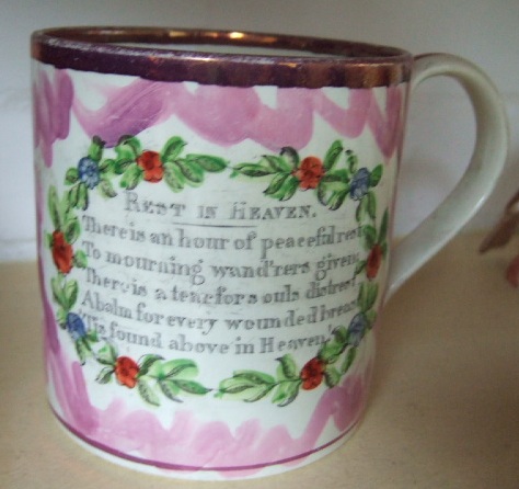 Appraisal: A Sunderland lustre ware mug th century hand painted with