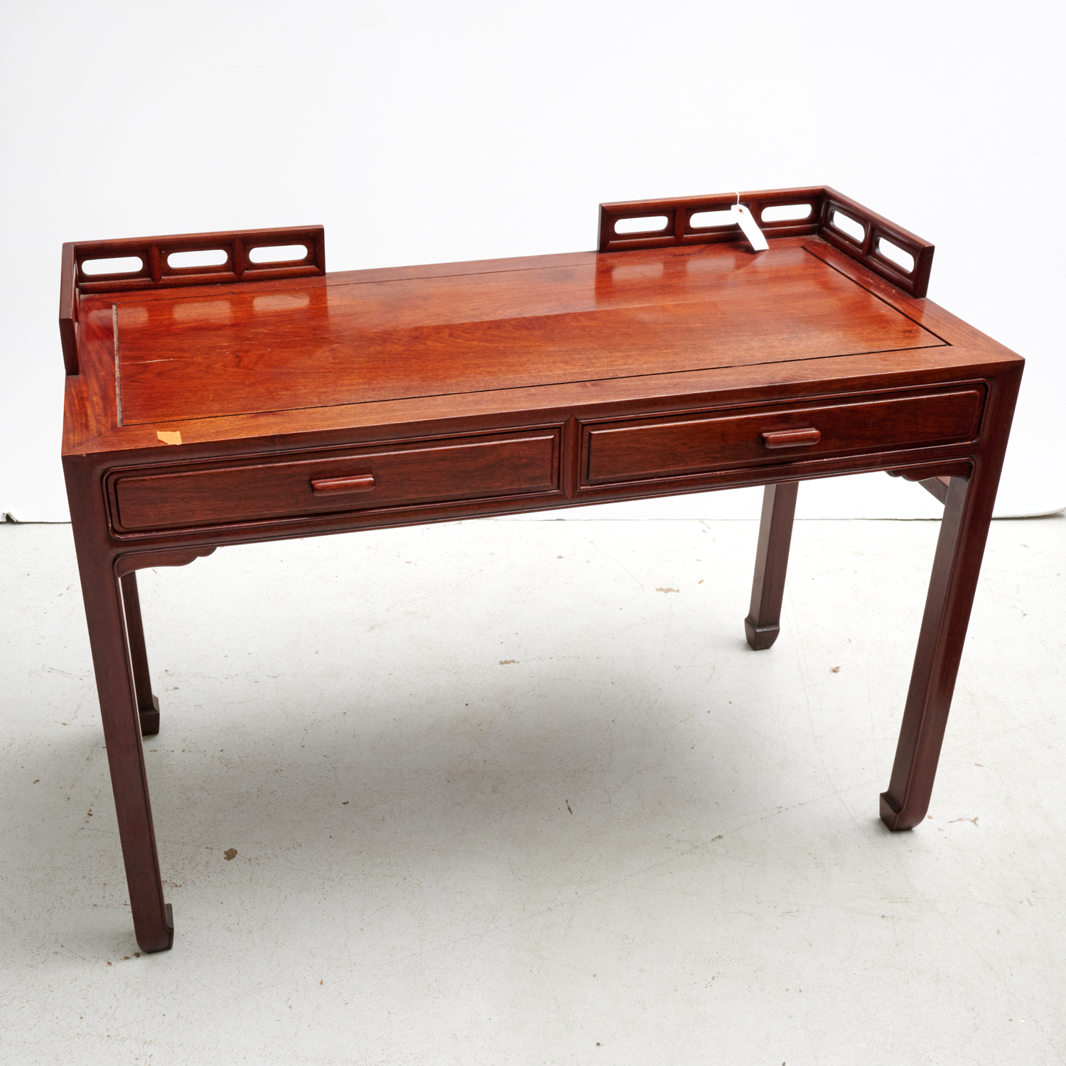 Appraisal: CHINESE HARDWOOD WRITING DESK th c with pierced gallery top