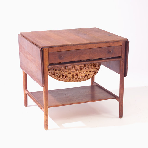 Appraisal: HANS WEGNER Drop-leaf sewing table with single drawer wicker basket