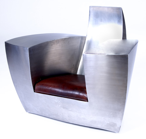 Appraisal: JONATHAN SINGLETON Easy Number One stainless steel armchair with drop-in